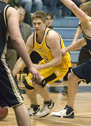 Andrew Olson works his way through traffic against Bethel.