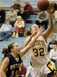Kenzie Consoer goes up strong to score for the Gusties.
