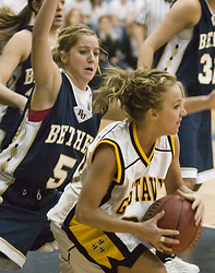 Ashley Raymo protects the ball from a Royal defender.