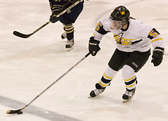Mari Gunderson plays the puck across the blue line.