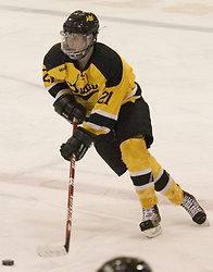 Joe Welch brings the puck up the ice.