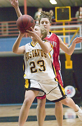 Ashley Raymo drives the lane for two against the Cardinals.