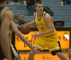 Kane Sivesind pushes the ball upcourt, looking to make a pass.