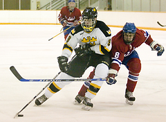 Eric Bigham carries the puck to the net for a scoring opportunity.