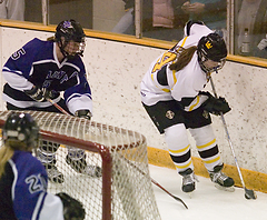 Claire Opsahl handles the puck behind her own net in the third period.