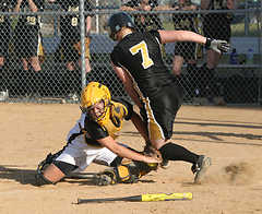 Abby Bernstein tags out a St. Olaf runner on throw from Emily Klein in game two.