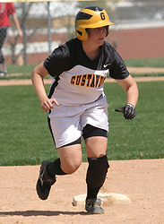 Tina Strauss rounds second and heads for third base.