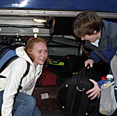 Junior Shawna Weaver (left) and senior Jill Johnson, prepare to leave for China with the Gustavus Symphony Orchestra.