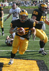 Mitch Anderson finishes a 12-yard td run late in the fourth quarter.