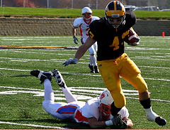 Chad Arlt makes the catch and eludes a Scot defender.