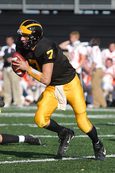 Quarterback Jordan Becker gets set to run the option play.
