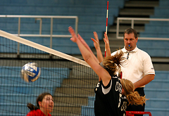 Britta Bolm and Andrea Kron block a Jessica Mate hit.