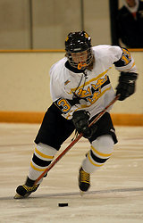 Kirstin Peterson races up the ice with the puck.