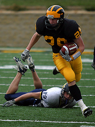 Cody Sukalski streaks past a Carleton defender on his way to a 60-yard touchdown reception.
