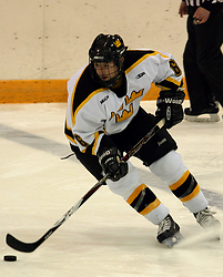 Cody Mosbeck brings the puck over the blue line.