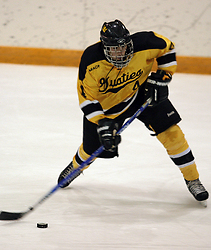 Sophomore Tony Palma lets rip with a shot at the St. Olaf net.