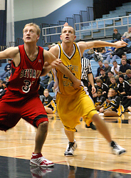Robbie Schmidt battles for a rebound off a free throw attempt.