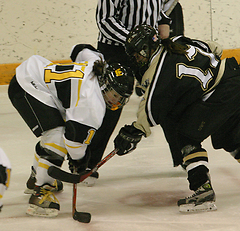 Lynn Hillen and Meghan Stumpf fight to win the face-off.