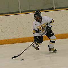 Kelsey Johnson looks to pass the puck.