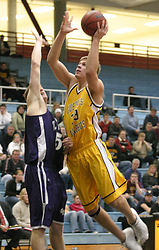 Andrew Doble goes up strong for two points.