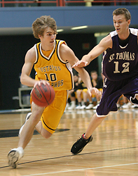 Freshman guard Dan Schmidtknecht drives to the basket.