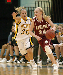 Emily Nelson pressures Britta Schwartzhoff on the perimeter.