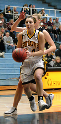 Julia Schultz looks to shot a lay-up as an Ole defender comes from behind.