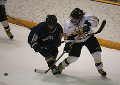 Alyssa Saunders fights to get to the puck.