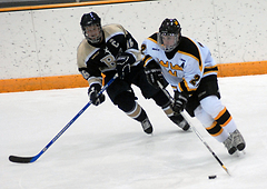 Senior Tim Ornell carries the puck up the ice against Bethel last weekend.