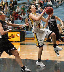 Julia Schultz drives for two of her seven points.