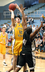Ryan McPartland scores two points off an offensive rebound.