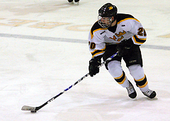 Mitch Carlson looks up the ice as he starts a Gustie rush. 