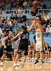 Jess Vadnais hits a three-pointer over Jessica Arechigo.
