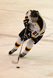 Joe Welch quickly carries the puck up the ice.