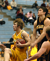 Ryan McPartland comes down with a rebound.