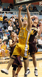 Andrew Doble puts up a shot under the basket.