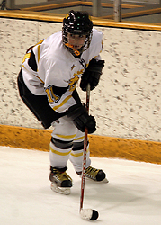 Lynn Hillen looks for the outlet pass in the Gustavus end.
