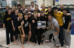 The Gustavus men's team with their first place trophy.  (Photo Courtesy Ryan Coleman, d3sports.com)