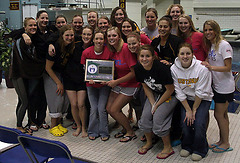 The Gustavus women's team with their first place trophy.  (Photo Courtesy Ryan Coleman, d3sports.com)