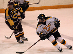 Rory Dynan pushes the puck up the ice.  Dynan registered three assists in the game.