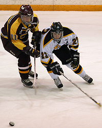 Tim Ornell battles for the puck.