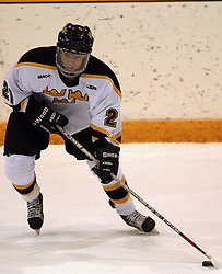 Joe Welch gets set to pass up the ice.