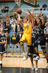 Andrew Doble maneuvers for a basket.