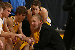 Assistant Coach Josh Drinkall talks defensive strategy during a timeout.  (Bridget Fowler photo)