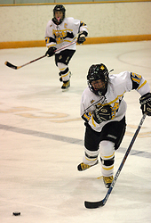 Jessica Doig chases a puck in the first meeting against St. Thomas.