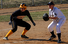 Gustavus runner leads off third base.