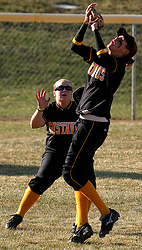 Rachael Click and Jenny Ewert play a fly ball.