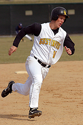 Spencer Campion rounds third and heads for home.