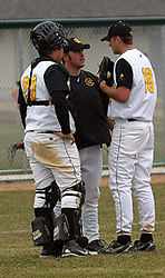 Pitching coach Josh Spitzack talks with pitcher Derek Eddie and catcher Shea Roehrkasse.