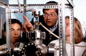 Professor of Chemistry Larry Potts works in the lab with students.